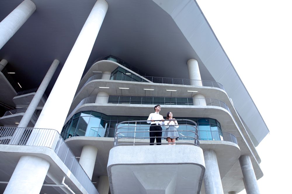Male and female student in APU campus.